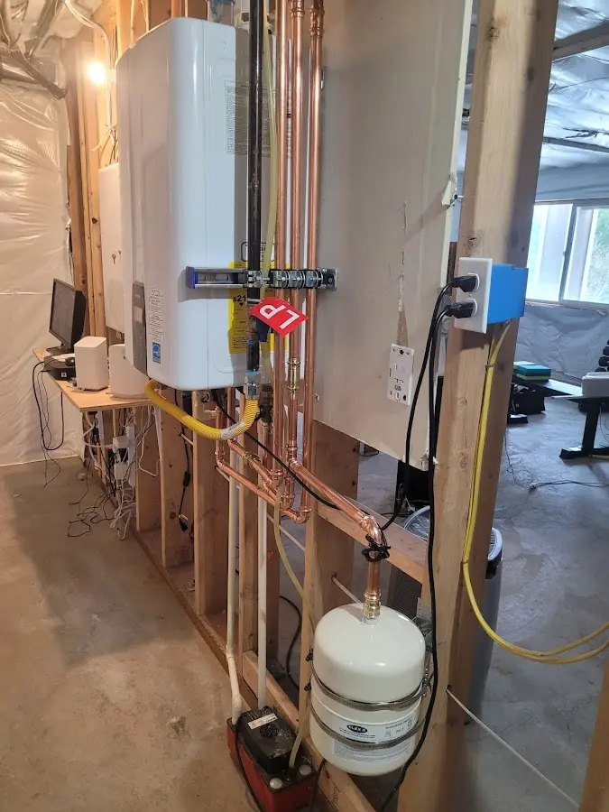 Licensed plumber repairing a kitchen sink in Portland